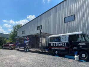 Two food trucks parked at Celerity