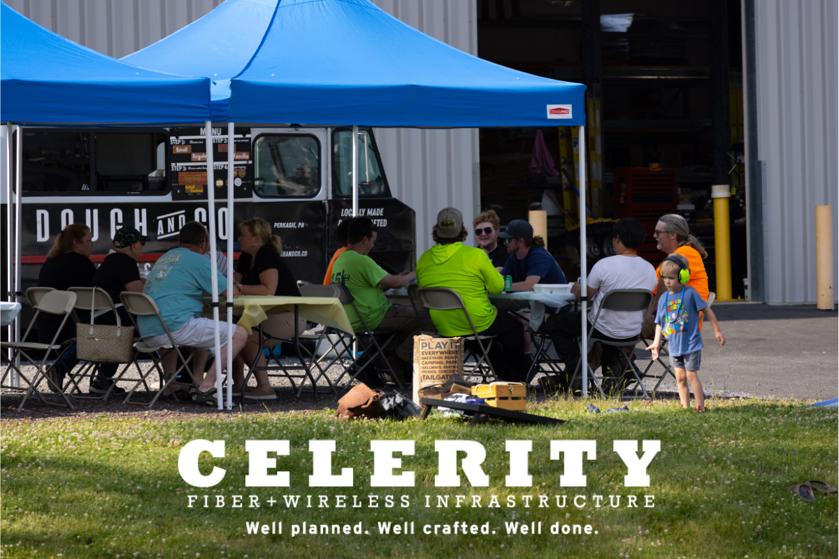 Celerity Food Truck Event Thumbnail. Employees sitting and enjoying food